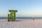 Beachcomber and Lifeguard Station on an Early Morning Beach