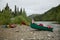 Beached canoes at campsite on wild Alaskan river