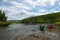 Beached canoes on scenic Alaskan river bank