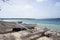 Beached indiginous canoe next to the ocean