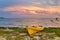 A beached yellow sea kayak on the beach at Fort Jefferson at sun