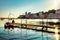 Beaches wharf backlit by bright sunset in selence bay at Sestri Levante. Genova Province, Liguria, Italy