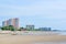 The beachfront building with the sky is the background.