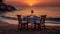 Beachfront dining Tables set for romantic sunset meals.AI Generated