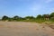 Beachfront Land for sale concept. Landscape of empty land plot for development project concept.