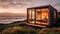 Beachfront tiny house with large windows in sunset