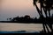 Beachgoer watches sunset near Kailua Bay,