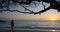 Beachgoer watching sunset at Waialea Beach