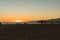 Beachgoers, families the sunset and the Santa Monica Pier