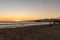 Beachgoers, families the sunset and the Santa Monica Pier