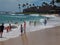 Beachgoers Play in the Surf