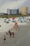 Beachgoers walking along the sandy shore, with stormy skies overhead,Jacksonville Beach,Florida,2015