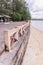 Beachside concrete retaining wall when low tide, Thailand