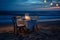 Beachside dinner table at twilight features soft candlelight, coastal decor. AI Generated