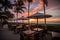 beachside eatery with outdoor seating and stunning sunset view