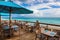 beachside eatery, with view of the ocean and waves, serving mouthwatering seafood dishes
