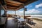 beachside eatery with view of rolling waves and sunny skies