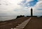 Beacon Capelinhos on the shore of Atlantic ocean, island Faial,