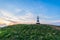 Beacon with the pointer on the hill in sunset light