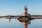 Beacon on the rocks and buoy of Saimaa Canal