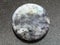 Bead from gray Labradorite gemstone on dark