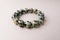 Bead stringing hand bracelet decoration. Hand made gem stone dalmatian jasper fashion accessory.