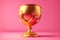 beaful festive golden cup on pink background