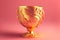 beaful festive golden cup on pink background