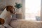 Beagle dog tired sleeps on a cozy sofa, couch, sun falls through window