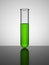 Beaker with green liquid. Test tube.