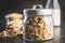 Beakfast cereals in jar. Healthy muesli with oat flakes, nuts and raisins