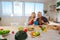 Beaming couple having much fun while enjoying breakfast