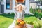 Beaming family woman cooking garden salad out from fresh vegetables outside