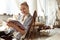 Beaming good-looking woman waiting for her session in salon