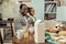 Beaming happy father and daughter sitting in the kitchen