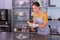 Beaming satisfied woman making photo of her perfect chocolates