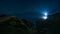 Beams of light shining from Fanad Head Lighthouse at dark night with sky full of stars