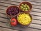 Beans corn and olives in red terracotta bowls