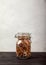 Beans, white and red, lentils green and red, peas in a closed glass jar on a black table on a white background. opy spaes