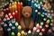 bear doll, surrounded by collection of different colored crayons