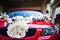 Bear dolls and flower decoration on car