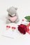 Bear, valentine and rose on a white background