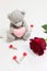 Bear, valentine and rose on a white background