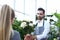 Beard Gardener Holding Hydrangea in Flowerpot