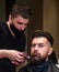 Beard grooming. perfect haircut with blade razor. barber master cut hair. mature hipster with beard at hairdresser