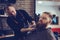 Beard styling and cut.Hipster client visiting barber shop.