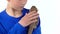 Bearded agama sitting on the shoulder of boy and he stroking her at white background. Slow motion. Close up