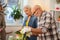 Bearded aged man being engaged in gardening