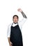 Bearded asian men waiter, chef dressed in black apron feeling serious raising fist up in white background.The concept of protest,