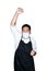 Bearded asian men waiter, chef dressed in black apron with medical mask is feeling serious raising fist up in white background.The